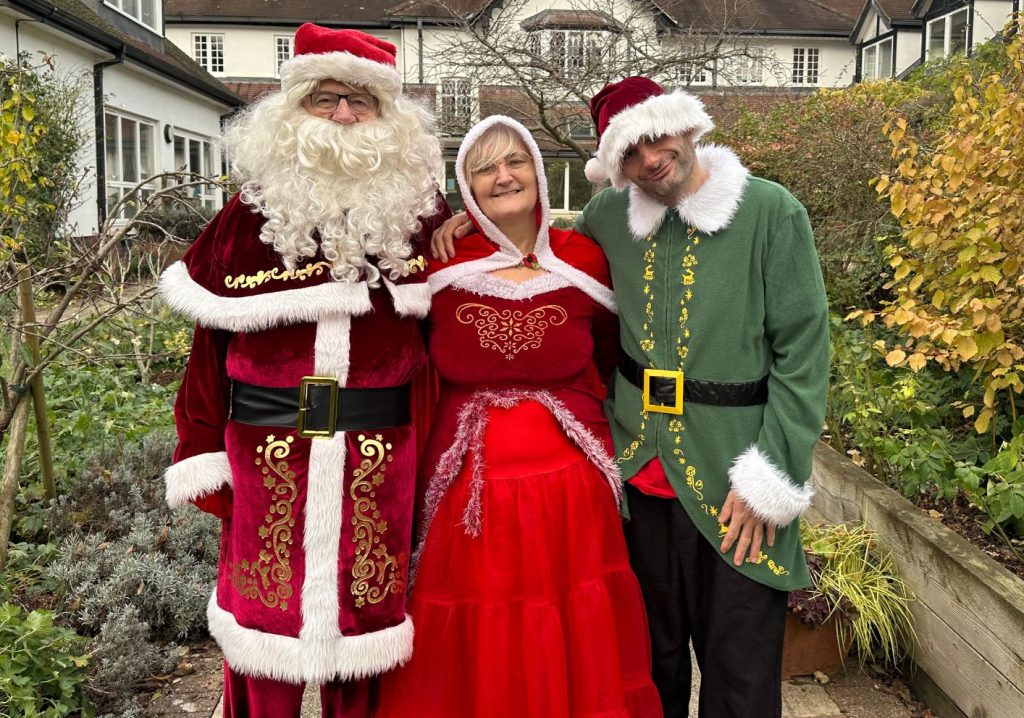 Santa, Mrs Claus and Helper Elf are excited about the Santa Dash!